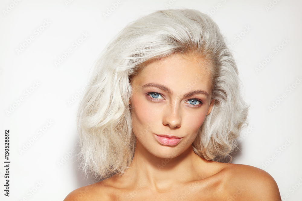 Portrait of young beautiful platinum blond woman with clean natural make-up Portrait of young beautiful platinum blond woman with clean natural make-up
