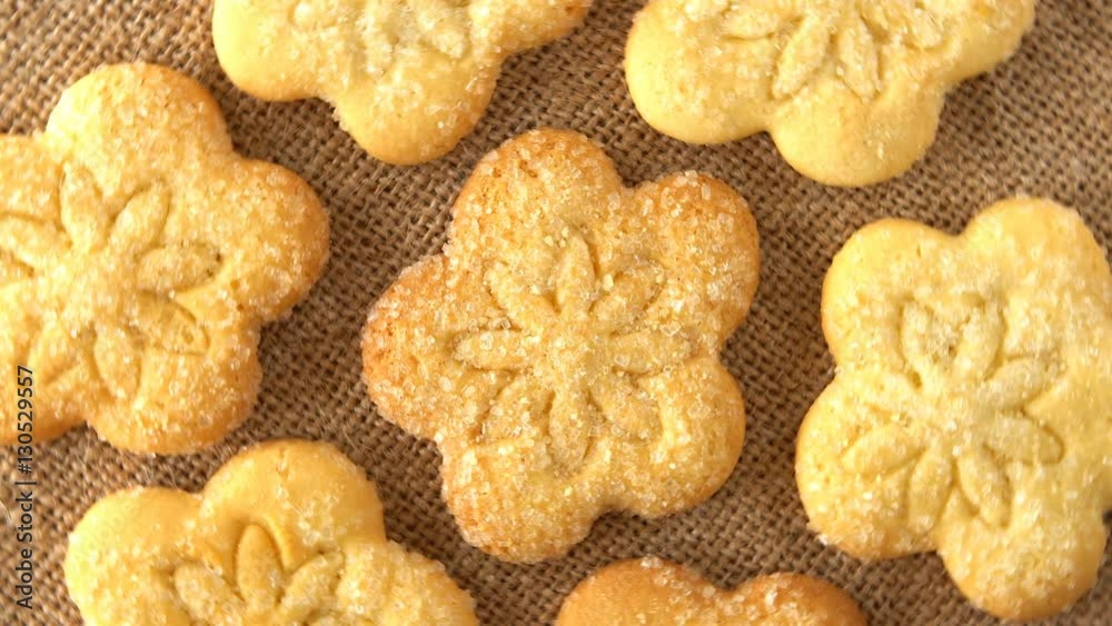 Delicious yummy freshly baked homemade cookies rotating on a sackcloth. Looped. Delicious yummy freshly baked homemade cookies rotating on a sackcloth. Looped.