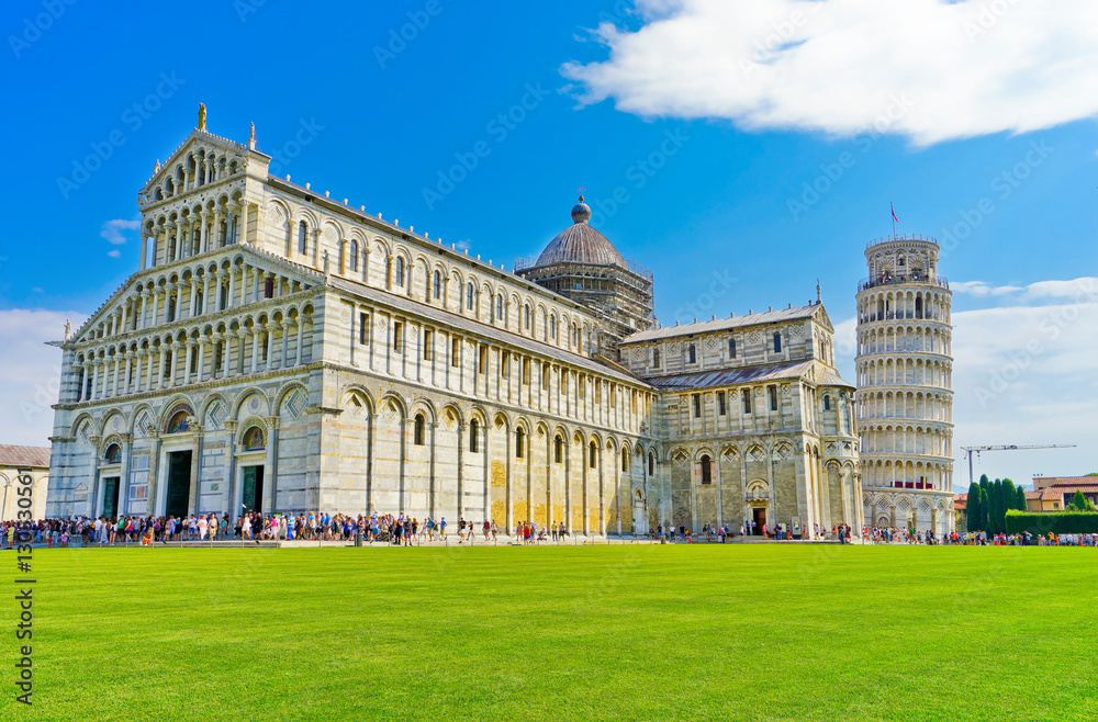 View of the Pisa Cathedral and the Leaning Tower in a sunny day in Pisa, Italy.