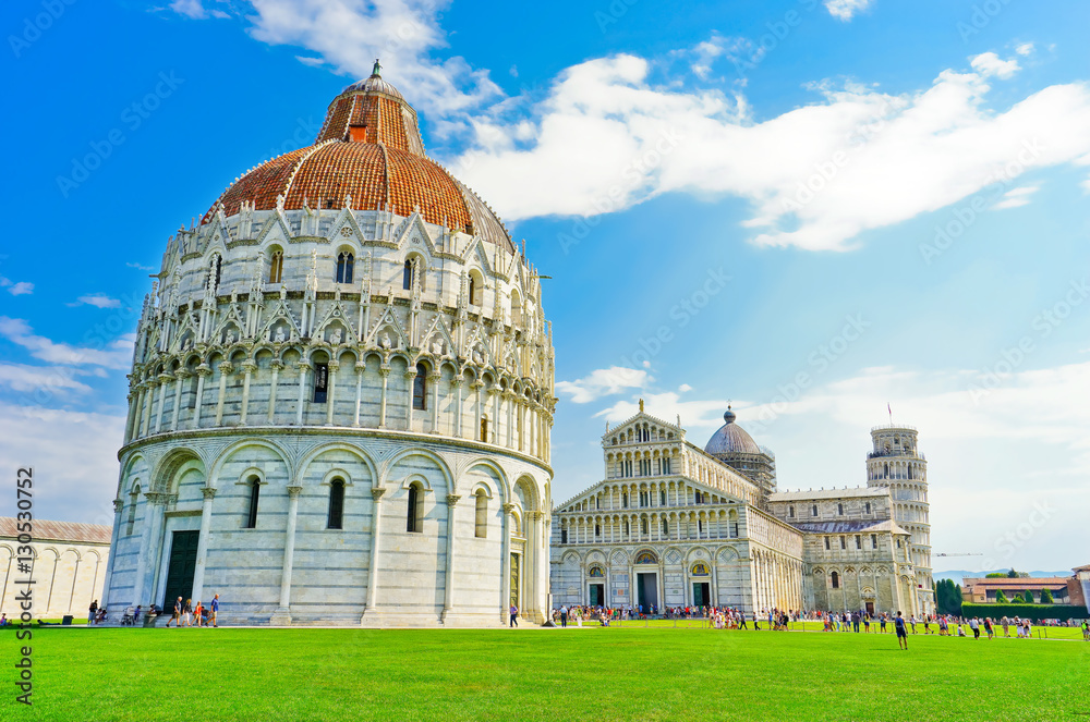 View of the Pisa Cathedral and the Leaning Tower in a sunny day in Pisa, Italy.