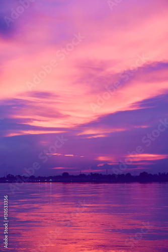 Fototapeta Naklejka Na Ścianę i Meble -  Purple Sunset Blazing Over the Mekong River in Nong Khai, Thailand