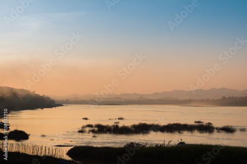 Beautiful sunset riverside in twilight time silhouette at Chiang Kan Thailand.