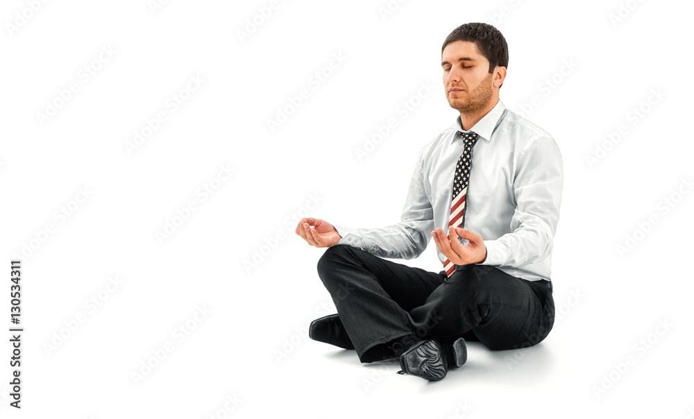 Businessman meditating in lotus pose Businessman meditating in lotus pose