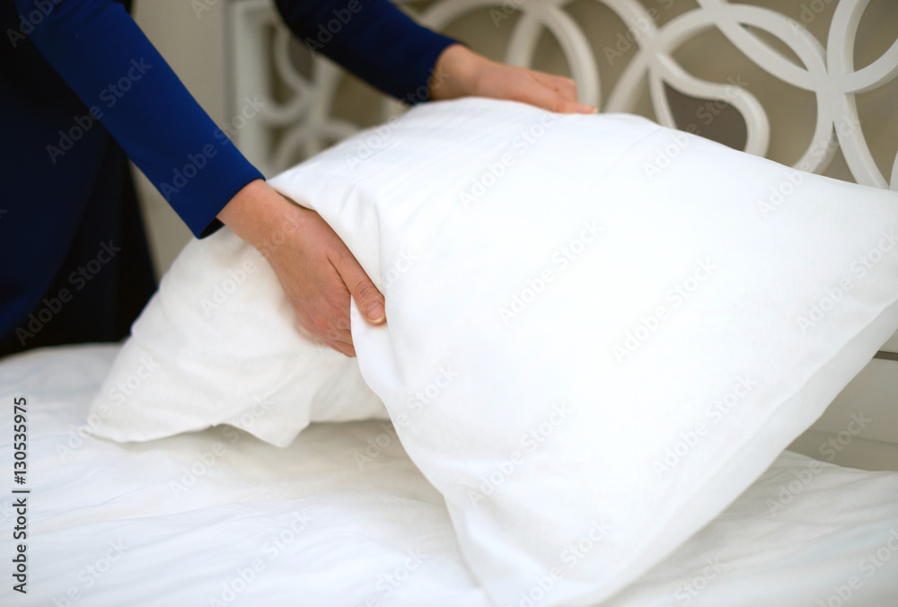Room service. Woman making bed in hotel room. Room service. Woman making bed in hotel room.