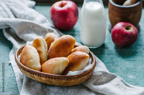 Breakfast with patties with apples in a wicker basket photo