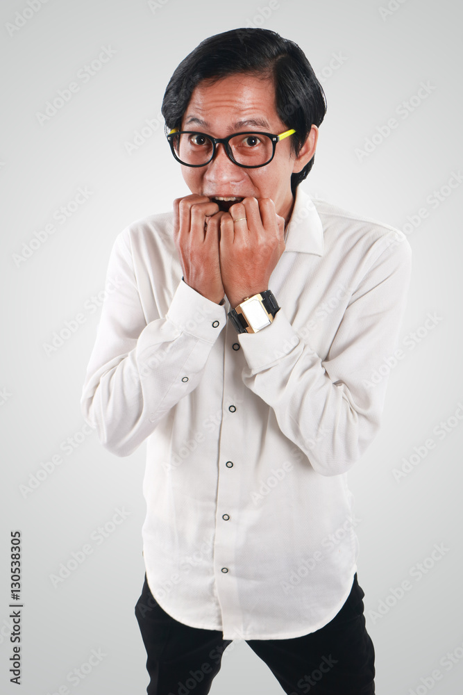 Worried Asian Businessman in Scared Gesture Worried Asian Businessman in Scared Gesture