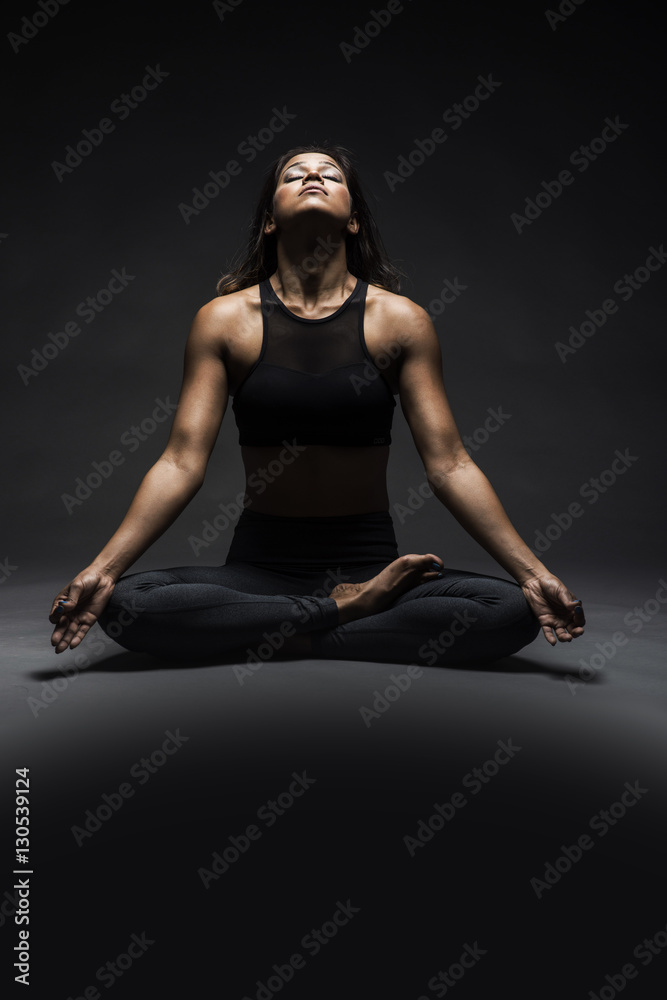 Beautiful Indian woman in yoga pose Stock Photo
