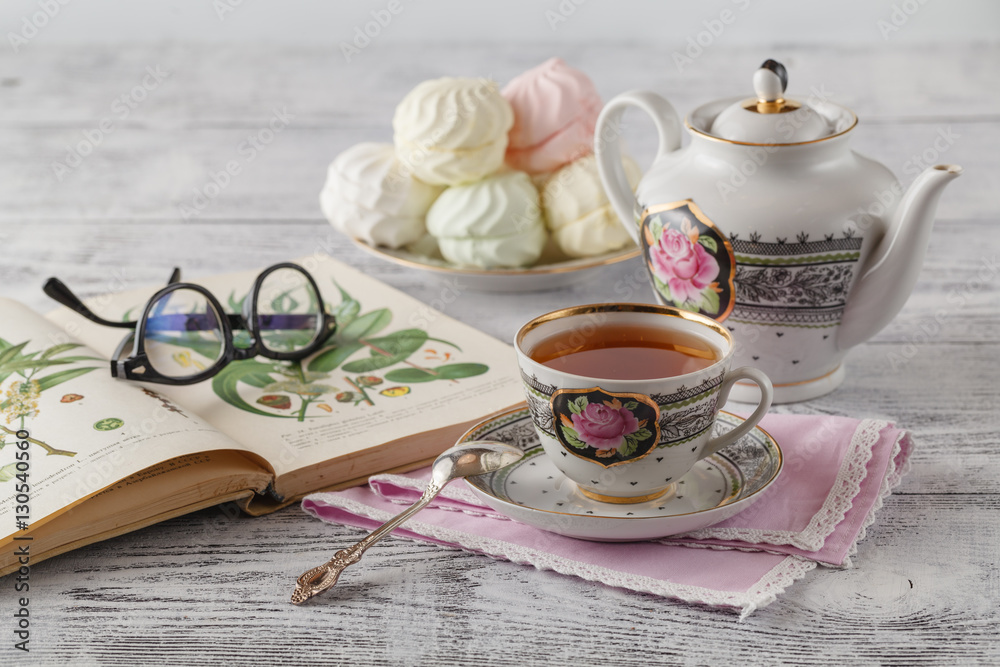 Breakfast in the morning with books and tea in china teacup Breakfast in the morning with books and tea in china teacup