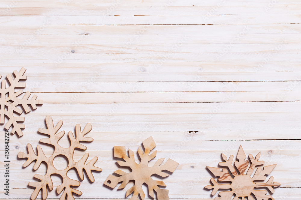 Snowflakes on wooden background