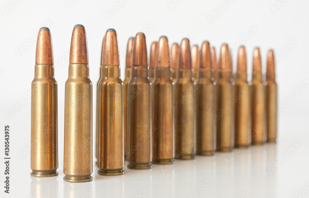 Rifle ammunition on white surface. Rifle ammunition on white surface.