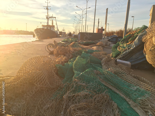 Photography sunset with fishing nets in the harbor of Fiumicino, Rome, Italy