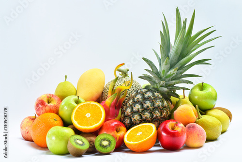 Group of tropical ripe fruits on white background