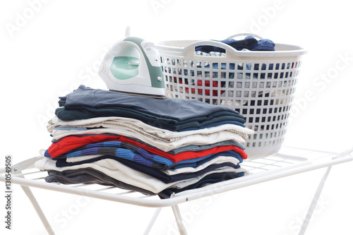 Laundry in a plastic basket, isolated on white