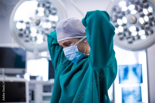 Female surgeon wearing surgical mask photo