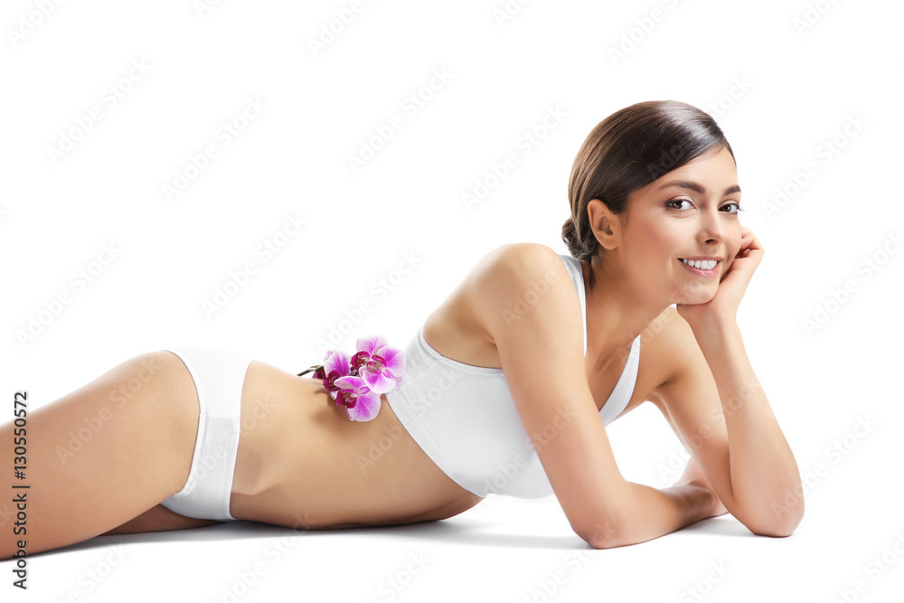 Obraz premium Beautiful girl with orchids, isolated on white