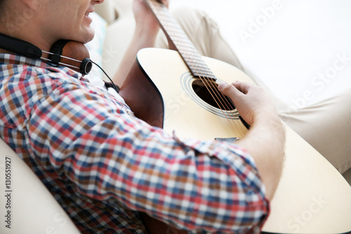 Closeup of young man playin...