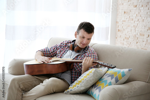 Young man with headphones p...