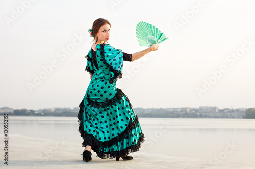 woman dancer wearing gren dress