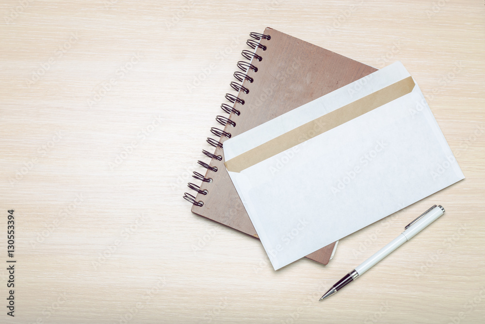 Photo of blank envelope on a  wooden background