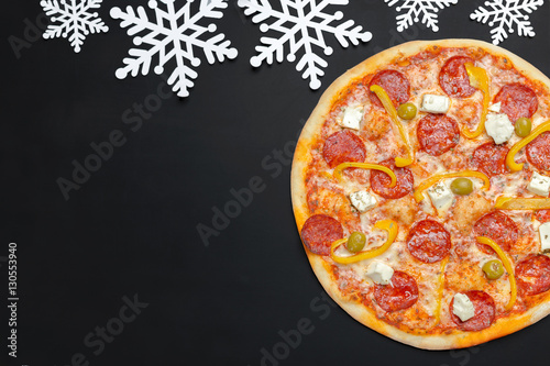Pizza with snowflakes decoration. Winter pizza