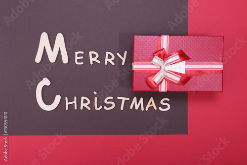 Merry christmas text and decorations on a red background