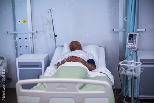 Male patient resting in ward