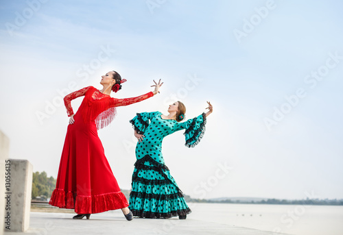 Obraz na plátně Flamenco dancers Spain womans in a long dress