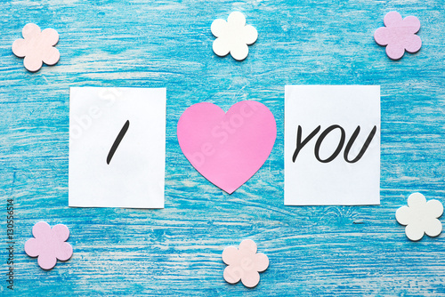 Valentines day decoration, words I love you on blue wooden background