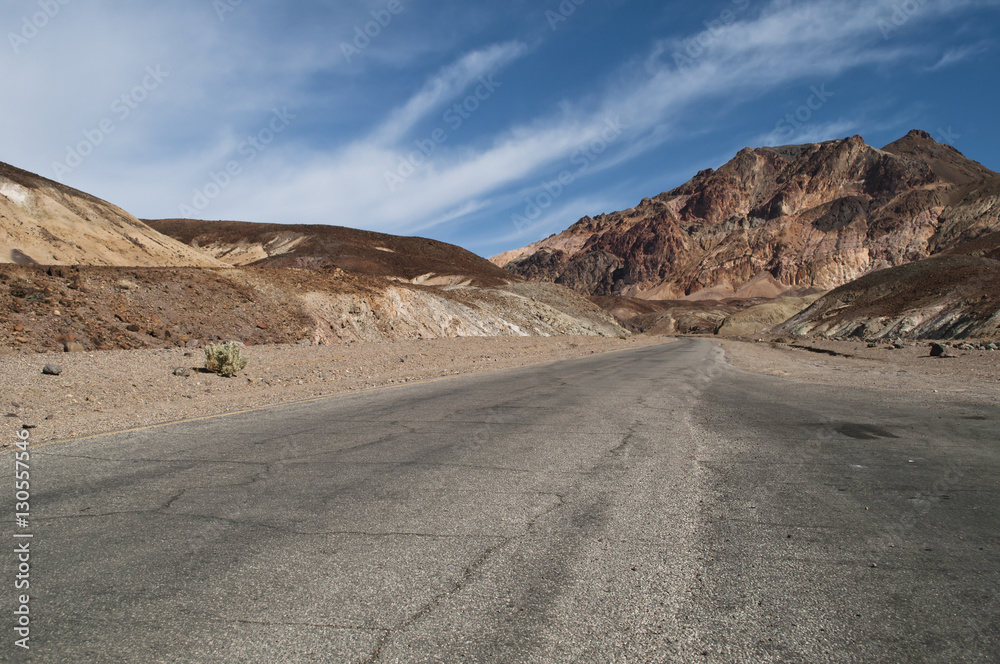Desert landscape and narrow road of the scenic Artist Drive in the Death Valley National Park, CA Desert landscape and narrow road of the scenic Artist Drive in the Death Valley National Park, CA
