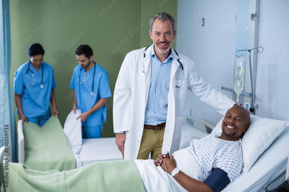 Portrait of doctor and patient in ward