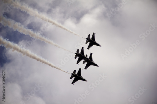 Low angle view of military airplanes flying in sky during airshow