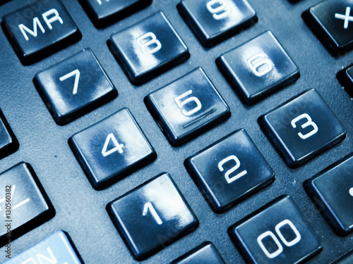 calculator buttons closeup numbers on a black calculator angle