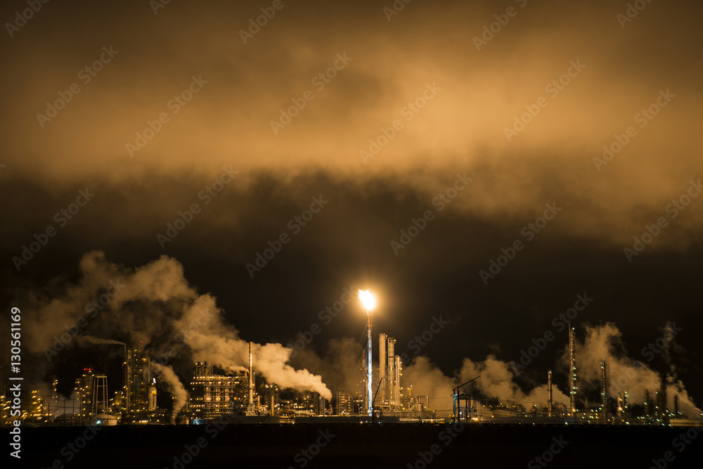 Smoke emitting from factory in sky at night Smoke emitting from factory in sky at night