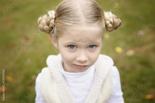 Portrait of girl standing in backyard