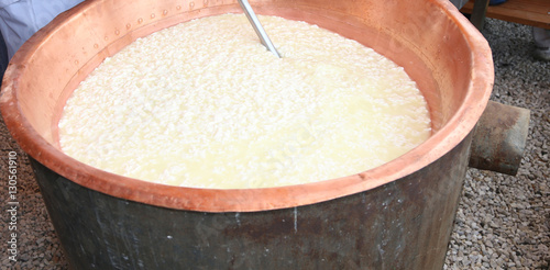 cauldron with the curdled milk to make cheese