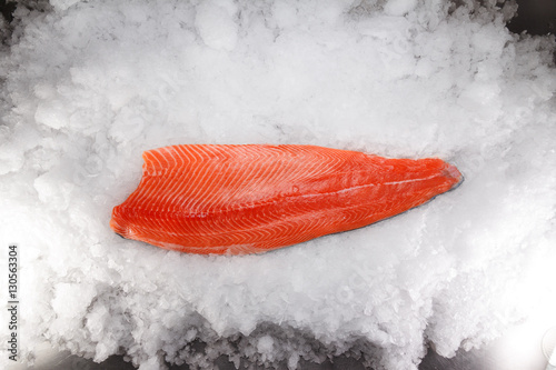Fresh raw salmon fillet on ice
