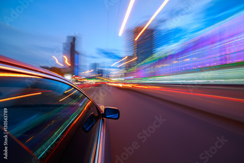 Blurred urban look of the car movement in a city street at nights. Longexposure shot.