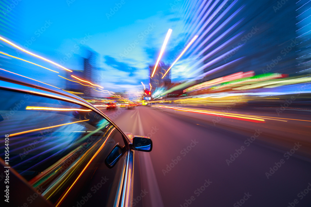 View from Side of Car moving in a night city, Blurred Motion