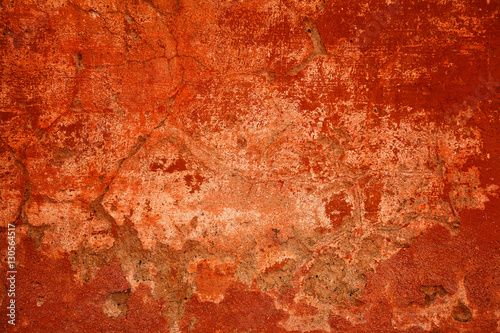 Design space. Abstract bright red background. Wall concrete damaged by time. Flat background with scratches and cracks