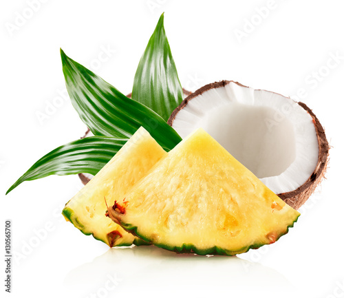 pineapple slices and half of coconut isolated on the white backg