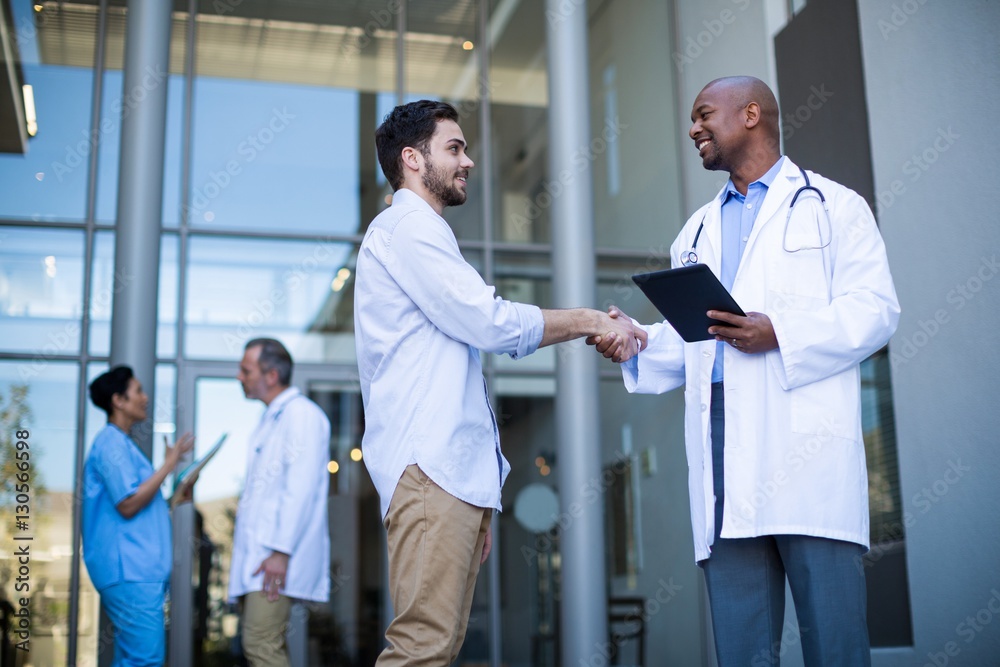 Doctor and patient shaking hands Doctor and patient shaking hands