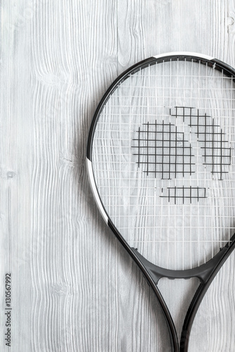tennis racket on wooden background top view © 279photo