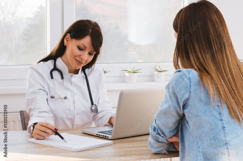 Patient Having Consultation With Doctor In Office Patient Having Consultation With Doctor In Office