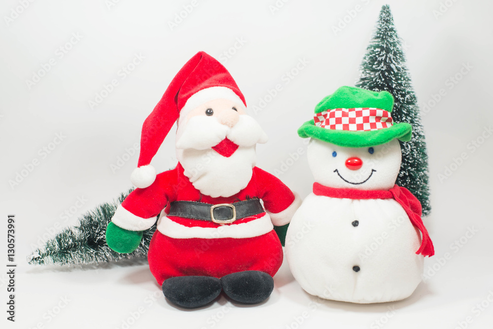 Snowman doll and santa doll with christmas tree on white backgro