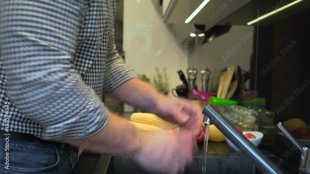 Close up on man's hands washing tomatoes. Slider shot.
Close up on man's hands washing tomatoes. Slider shot.