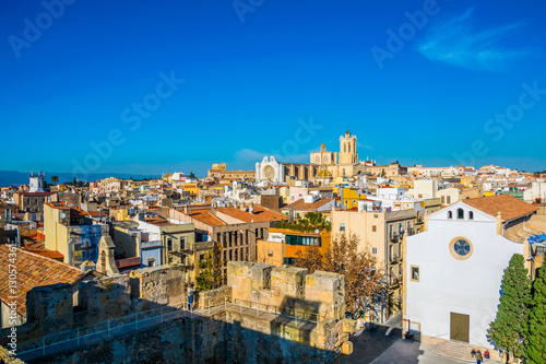 Aerial view of tarragona taken from the circo romano with the cathedral of saint mary on background photo