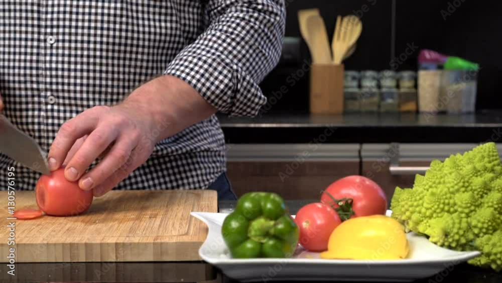 Close up on man's hands cutting tomatoes. Slider shot.
Close up on man's hands cutting tomatoes. Slider shot.