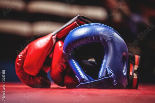 Boxing gloves and headgear in boxing ring