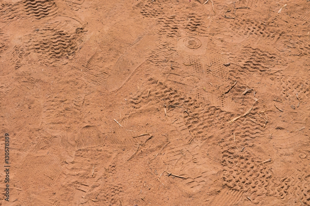 Many shoes footprint on dry red or orange soil or sand in Thaila Many shoes footprint on dry red or orange soil or sand in Thaila