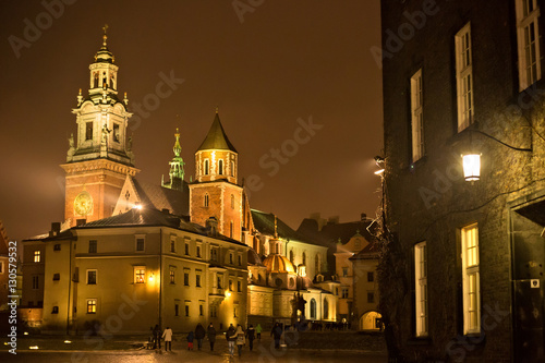 View of the Wawel Royal Archcathedral Basilica of Saints Stanislaus and Wenceslaus and Wawel castle on the Wawel Hill at winter night, Krakow, Poland.
